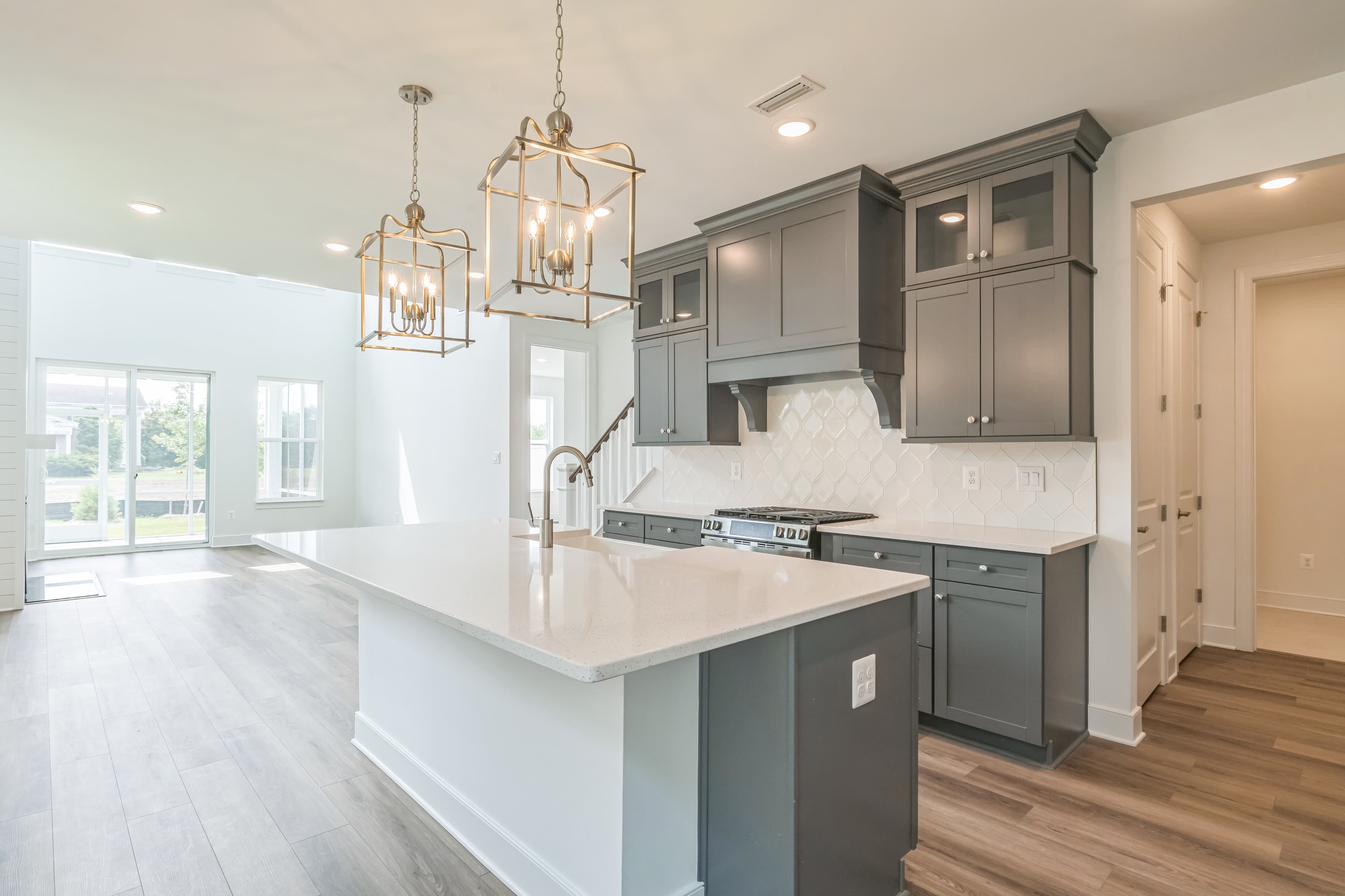Kitchen with brushed nickel pendant lighting