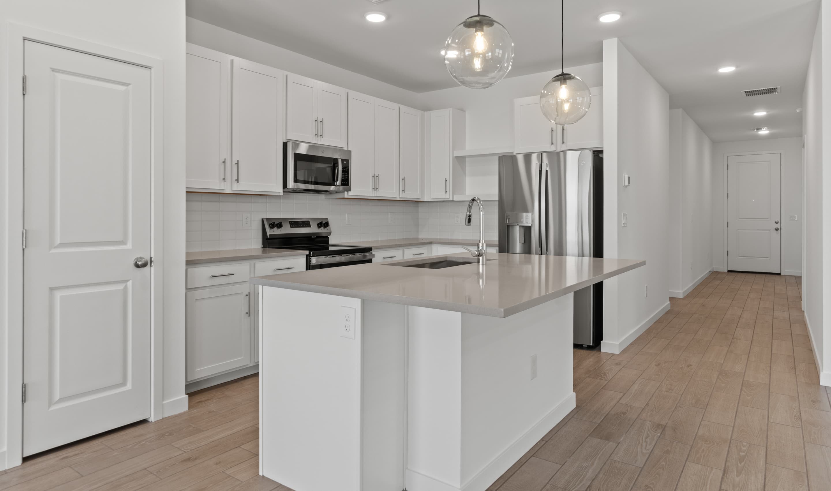 Kitchen with Meridian Grey quartz island & countertop
