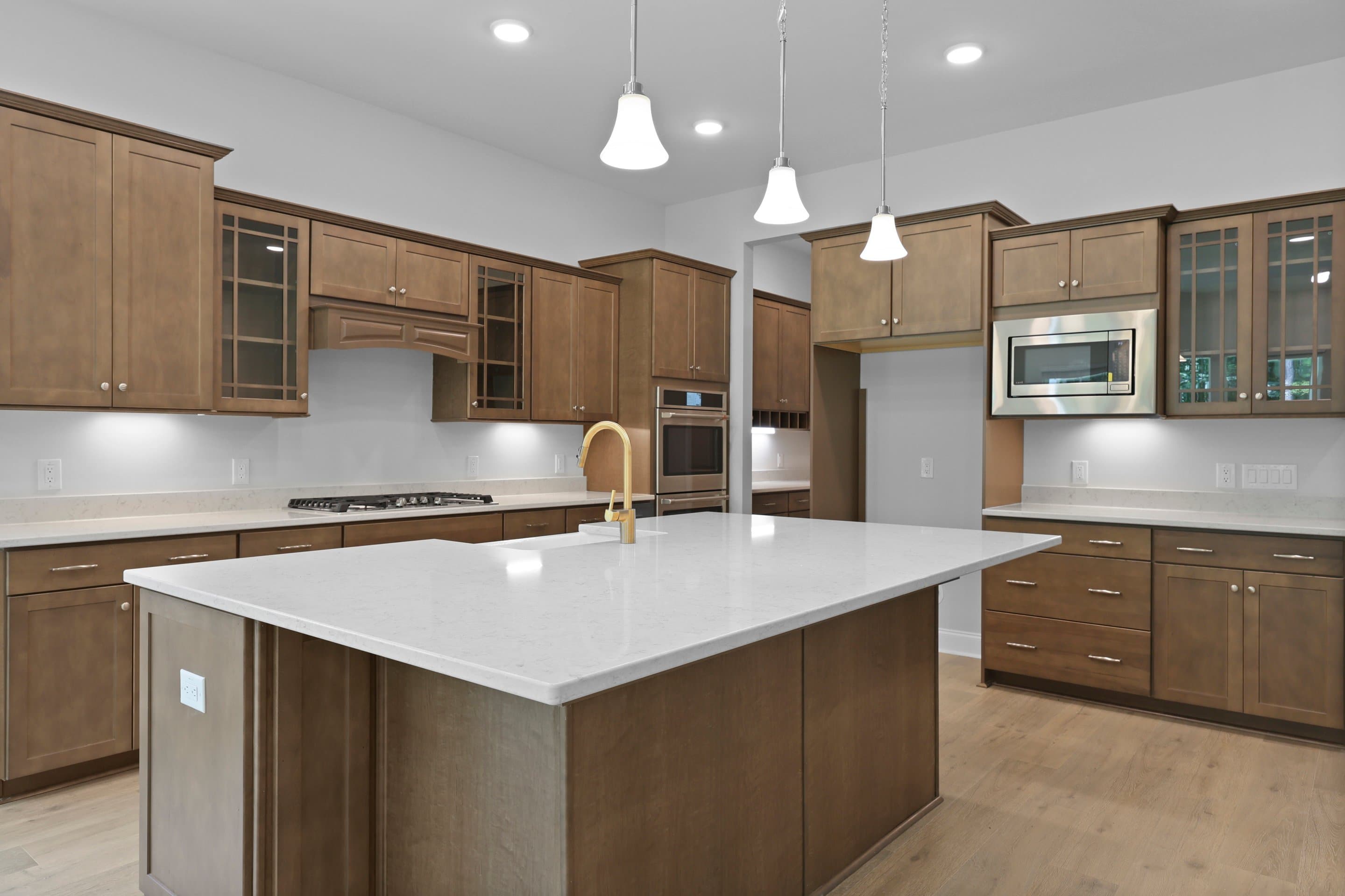 Kitchen with vast island & pendant lights