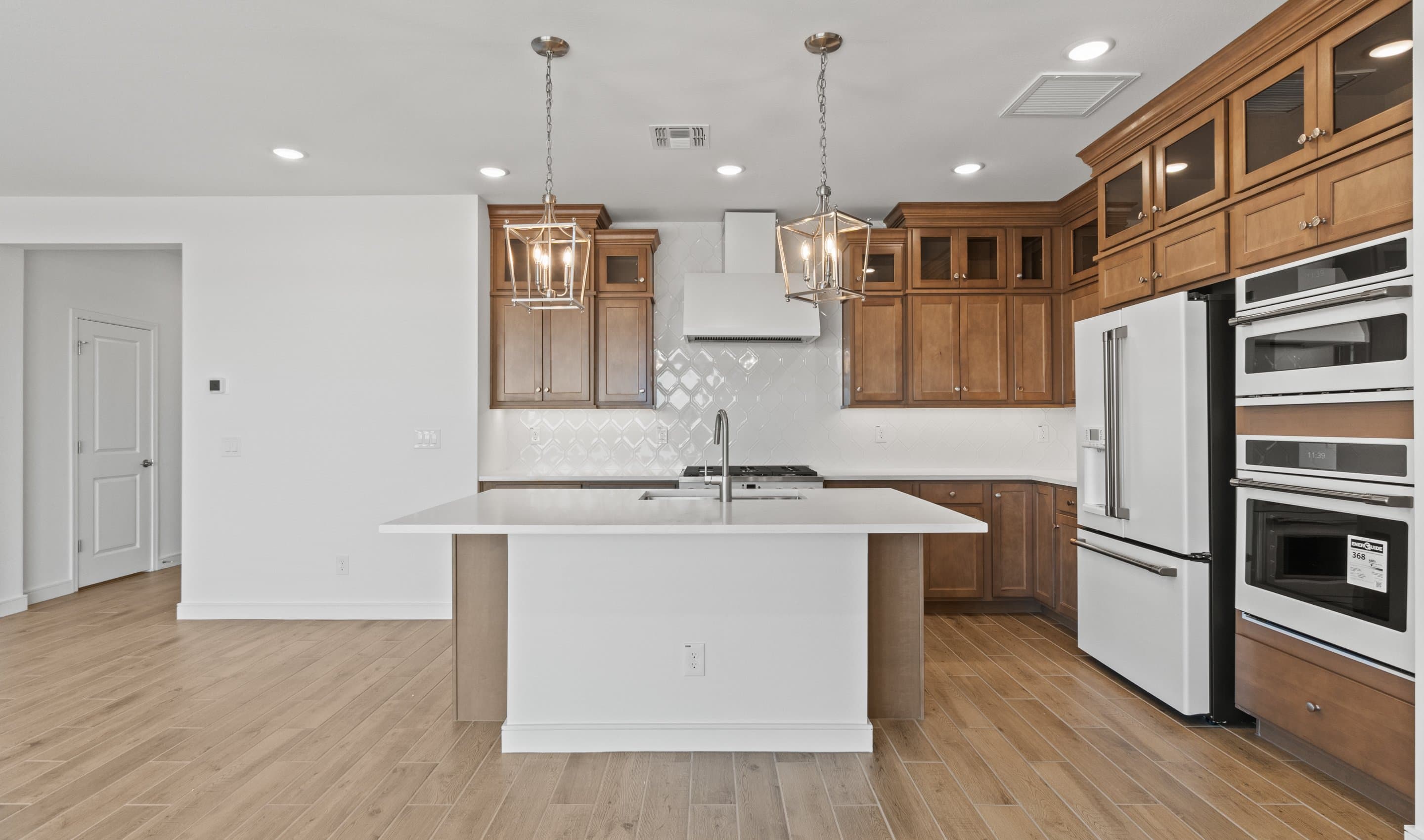 Kitchen with vast island & pendant lights