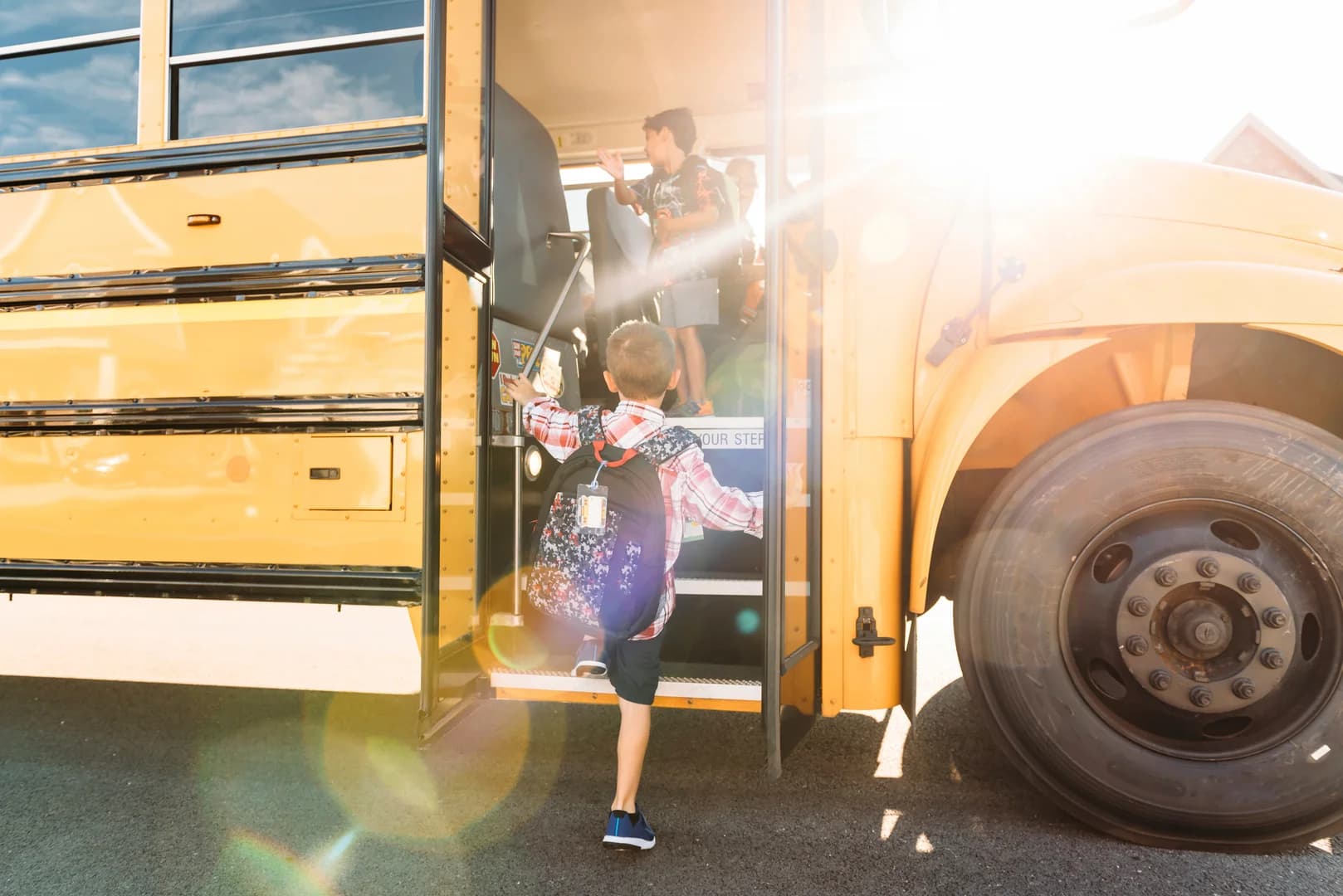 Boy Boarding the School Bus