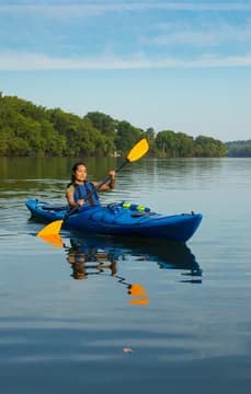 Woman Kayaking on Lake USP Crop