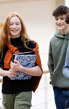 Students Walking in School Halls with Books