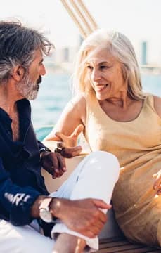 149503 Older Couple Dressed Nice on a Boat with City Background USP Crop
