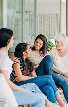 MultiGenerational Family Sitting Outside Patio USP Crop