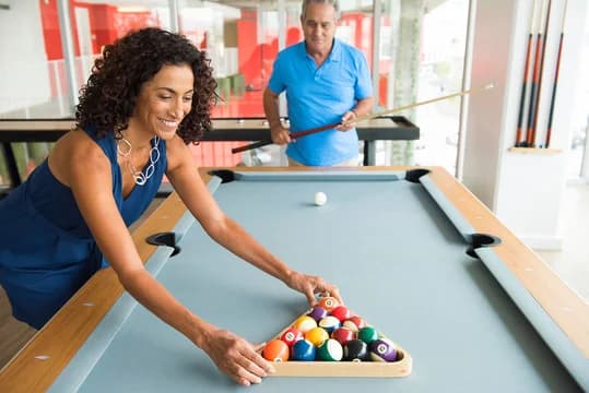 couple playing billards
