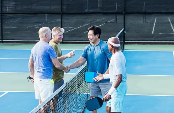 Senior Men Playing Pickleball