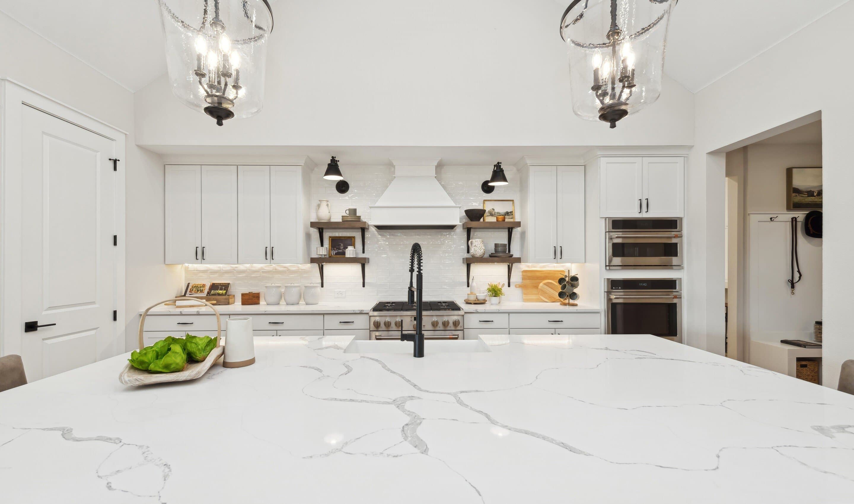 Kitchen with floating shelves and quartz countertops