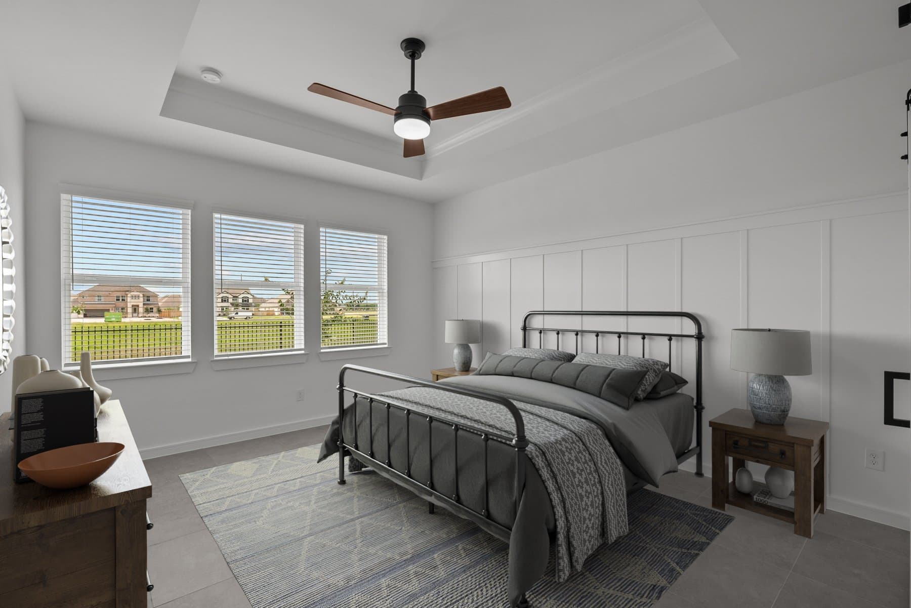 Primary suite with decorated feature wall & tray ceiling