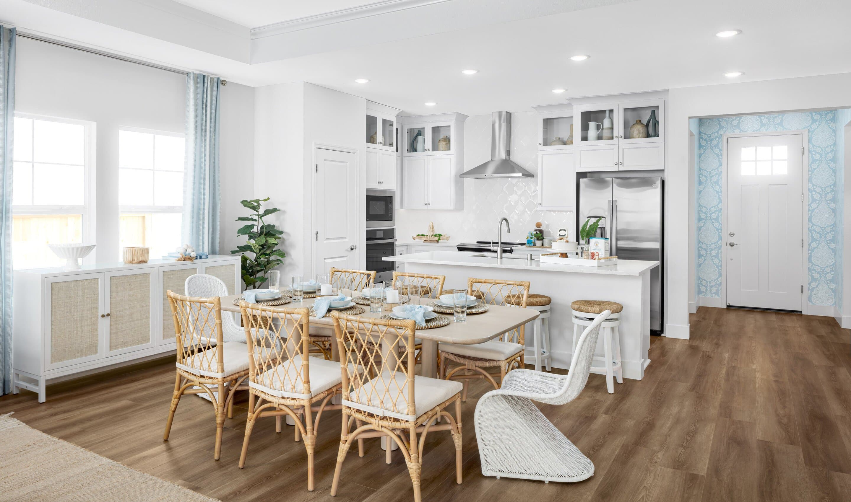 Kitchen with glass upper cabinets and dining area
