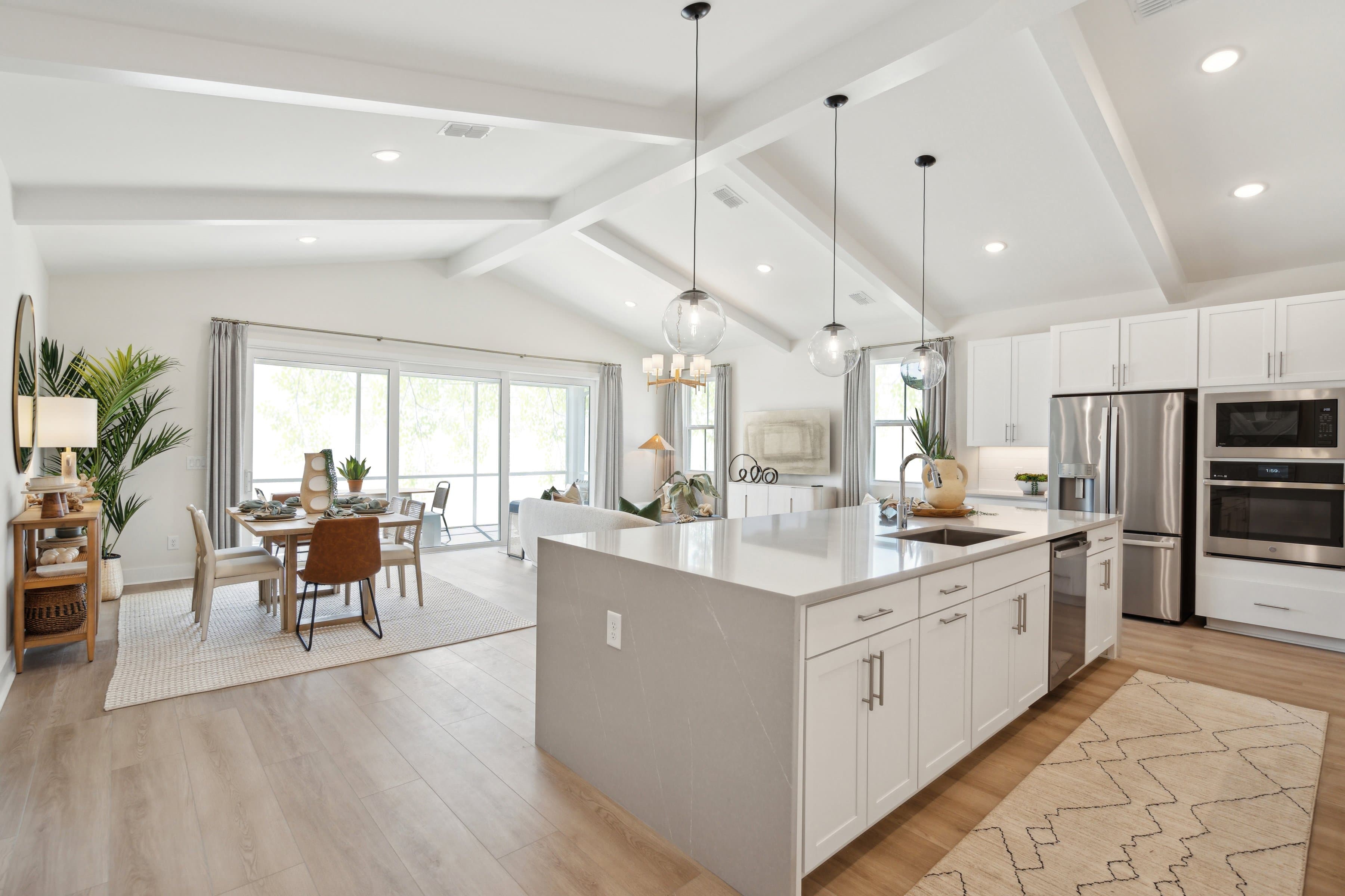 Kitchen with sleek pendant lighting
