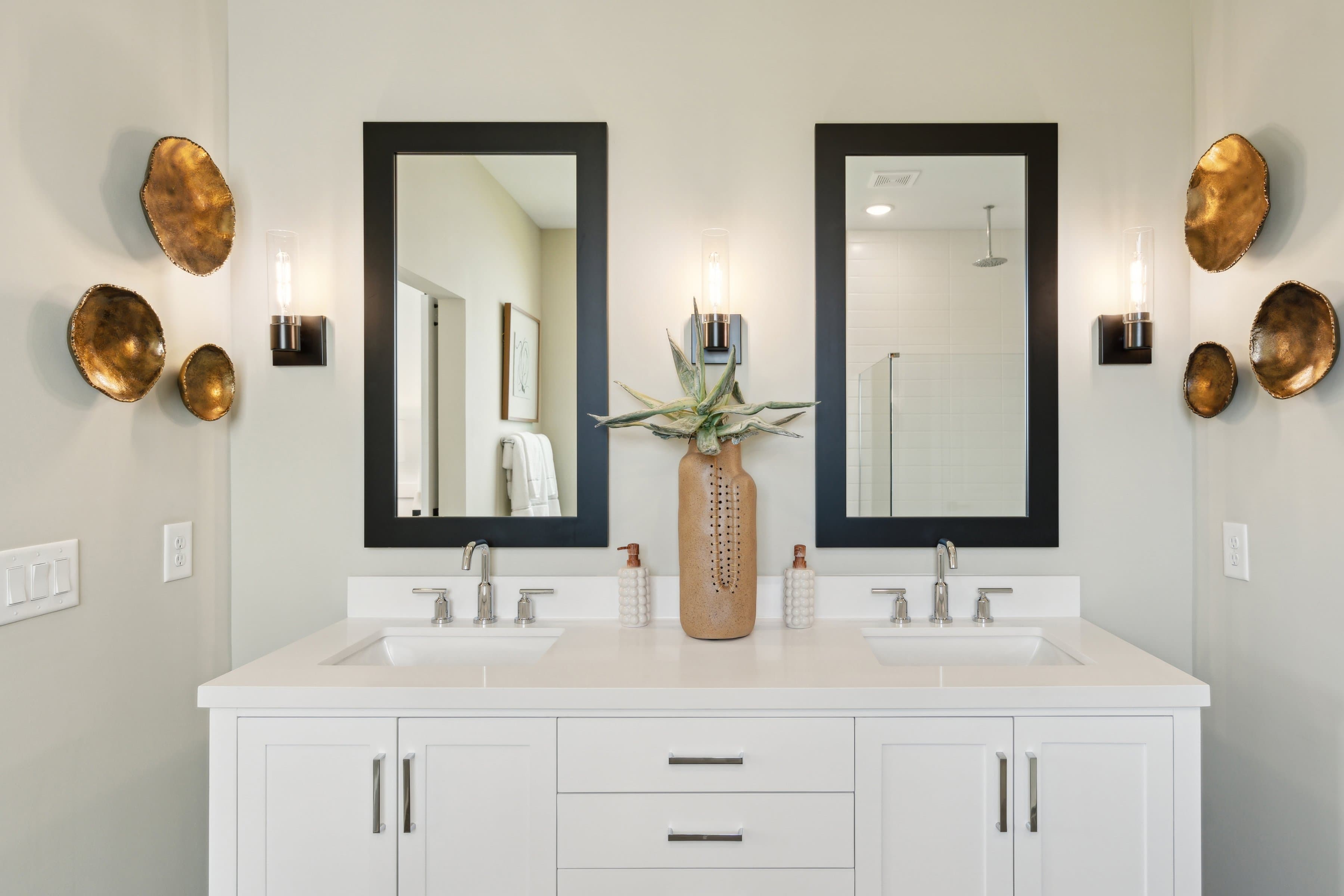 Primary bath features vanity with dual sinks