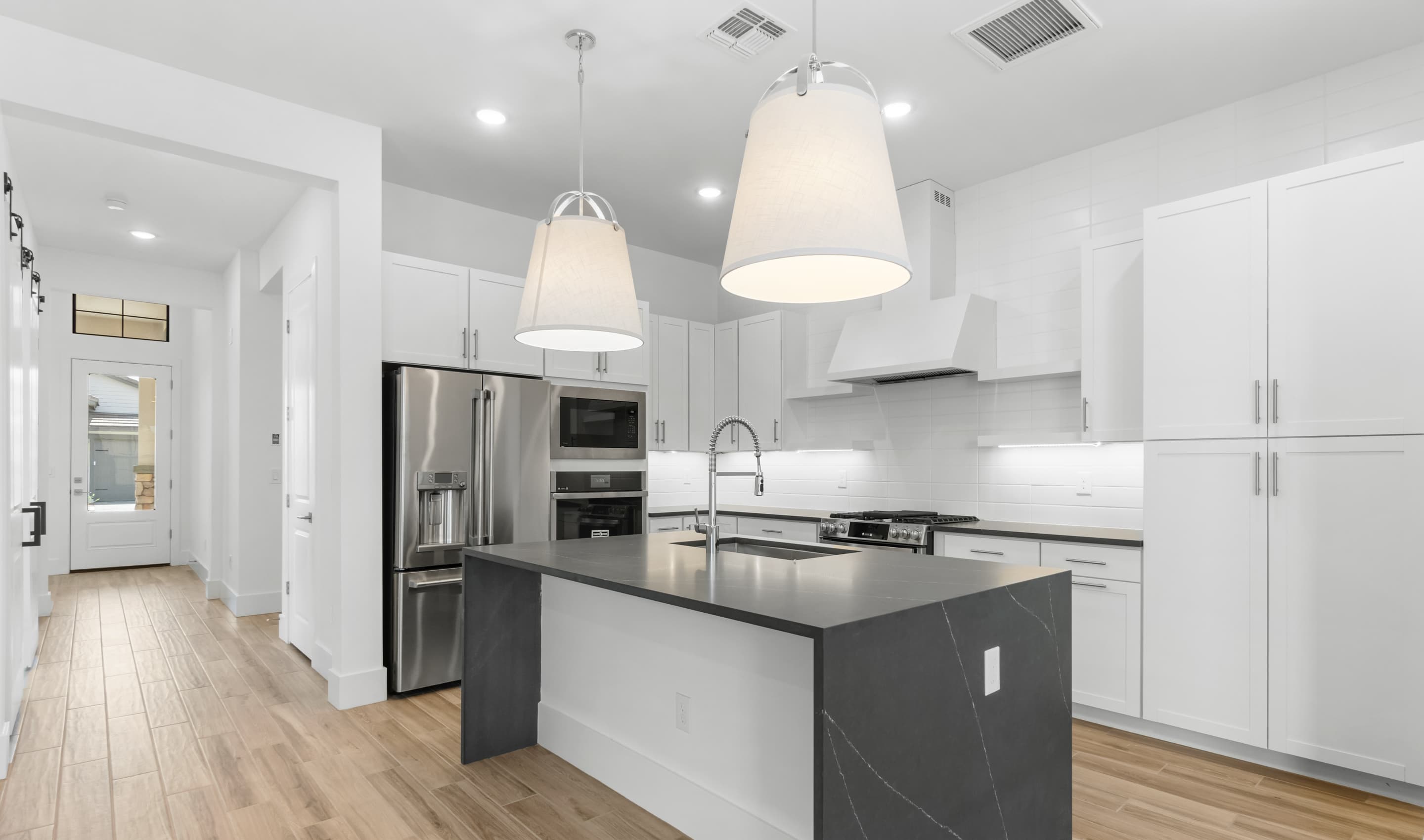 Kitchen with waterfall-edge central island