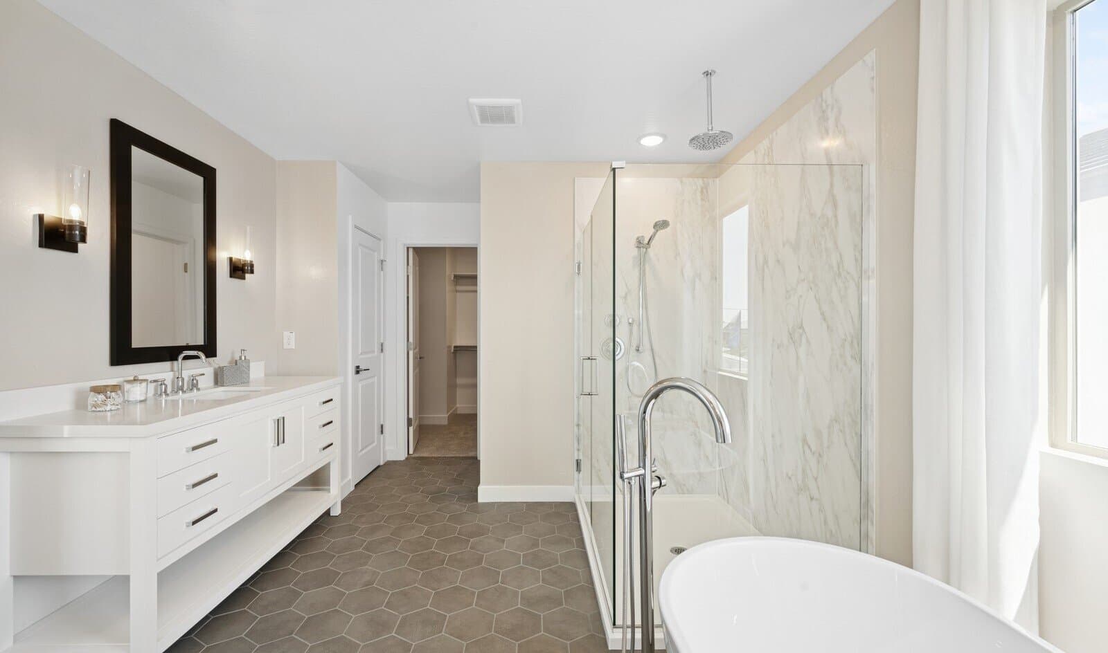 Primary bath with glass shower enclosure