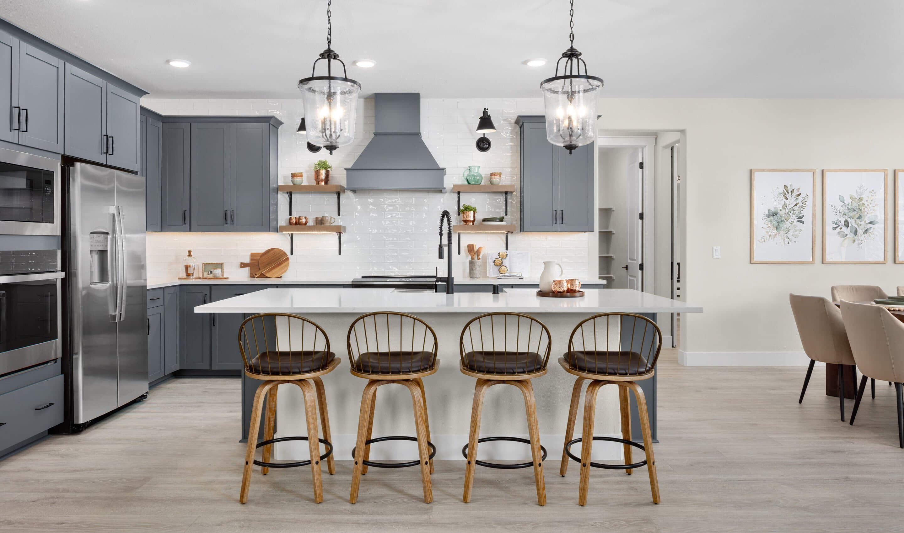 Kitchen with pendant lighting and stylish tile backsplash